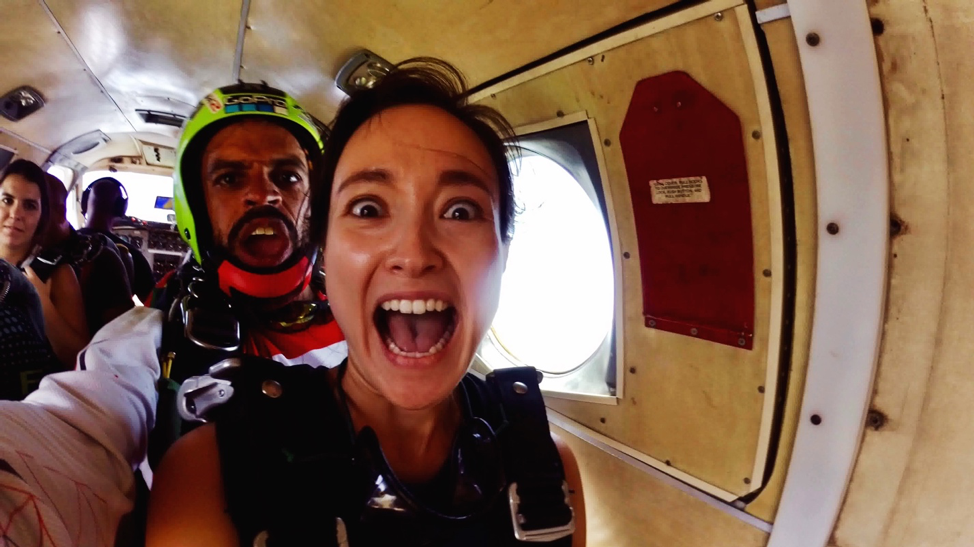 Skydiver's scared face before exiting the plane.