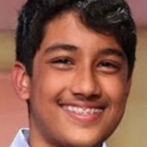Sharath, a young man with black hair, smiling at the camera