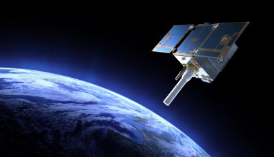 Blue satellite pointing down on Earth from orbit