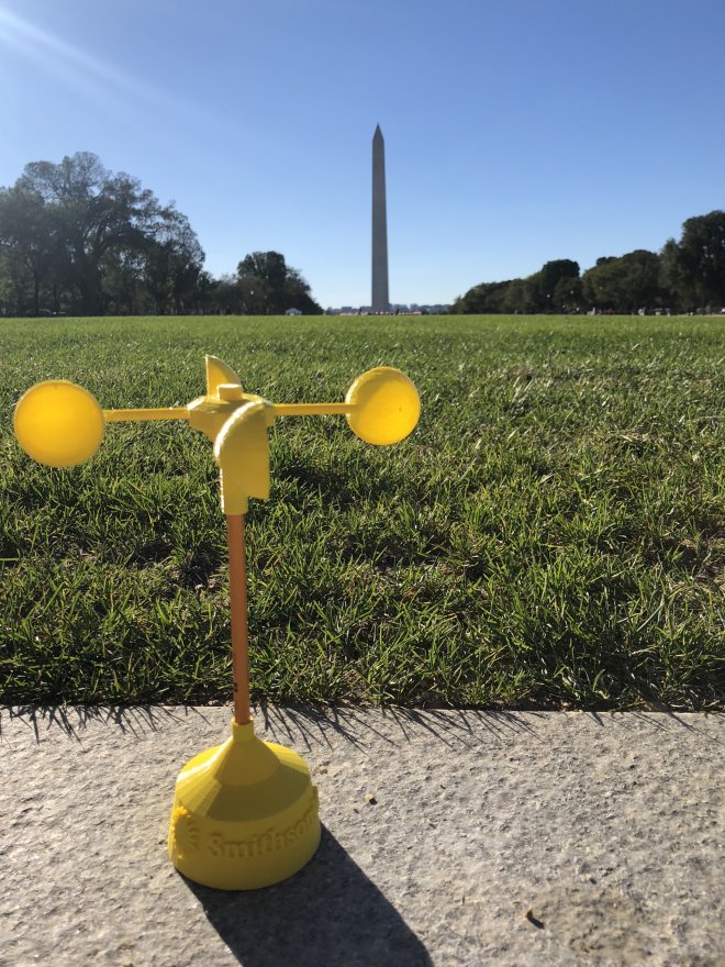 A 3d printed anemometer on the National Mall in Washington DC with the Washington Monument in the background