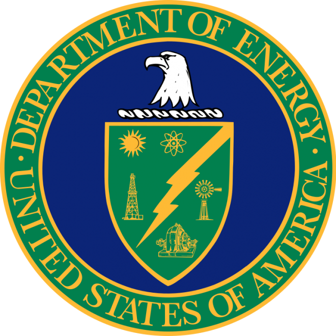 A blue circle with an eagle head above a green shield with a green ring around the circle with text that says Department of Energy United States of America.