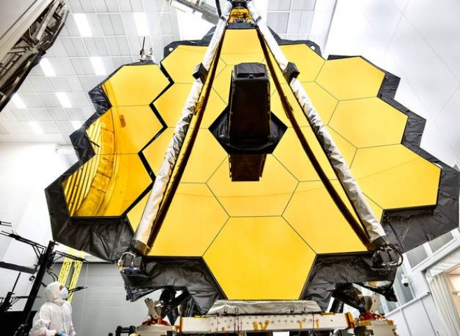 A close up view of the James Webb Space Telescope's gold hexoganal primary mirror.